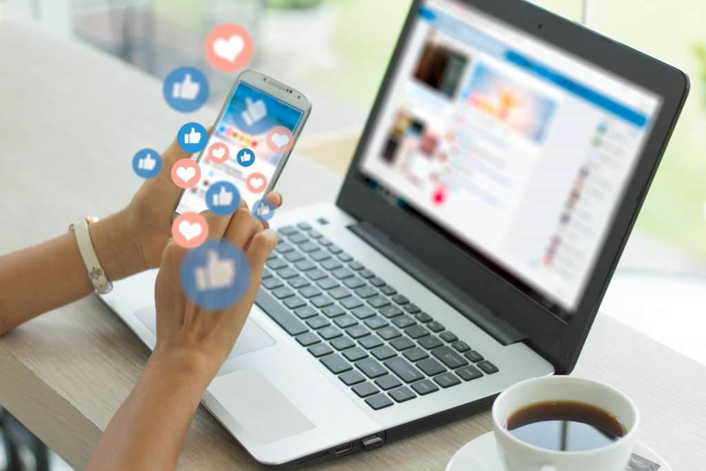 engagement and notifications popping up on woman's phone and laptop