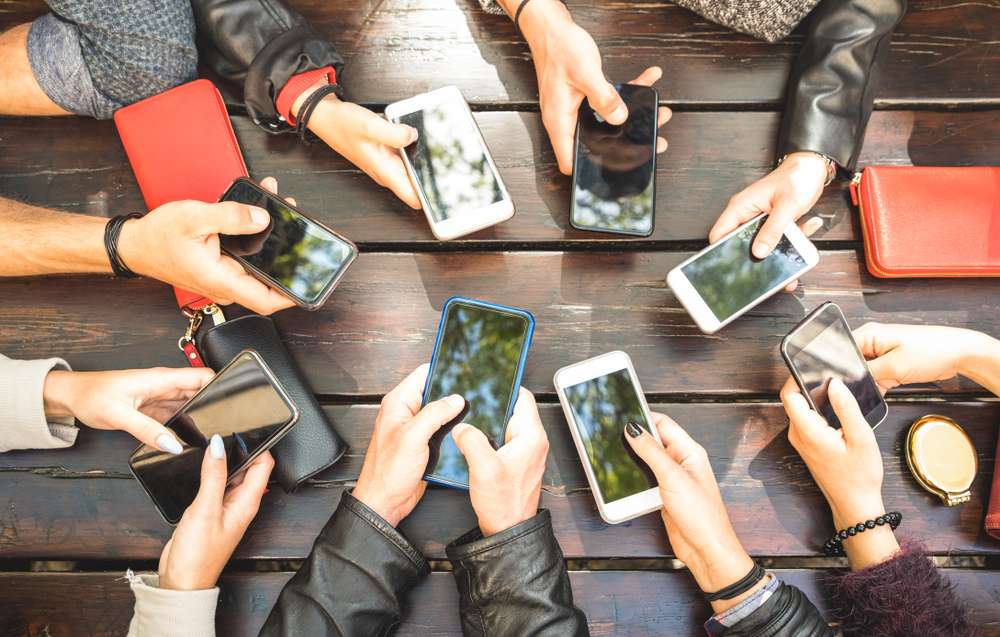 Group on social media on their phones