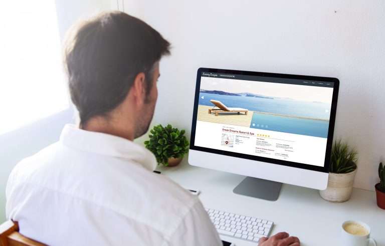 man looking at resort and spa website