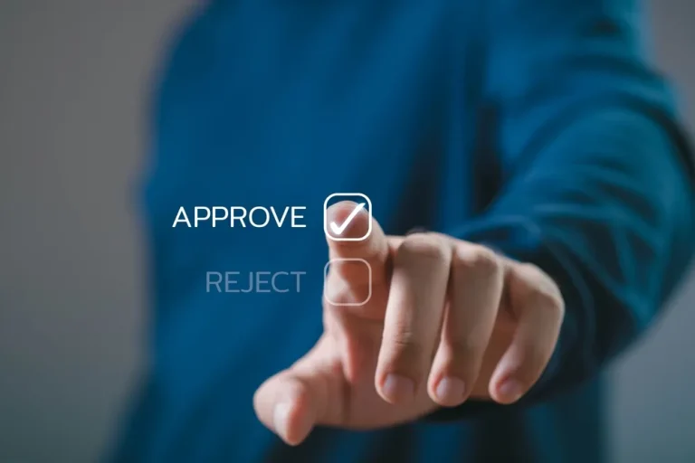 Close-up of a person touching a virtual button to approve a choice