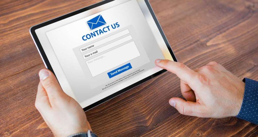 Man,Submitting,Contact,Form,On,Website