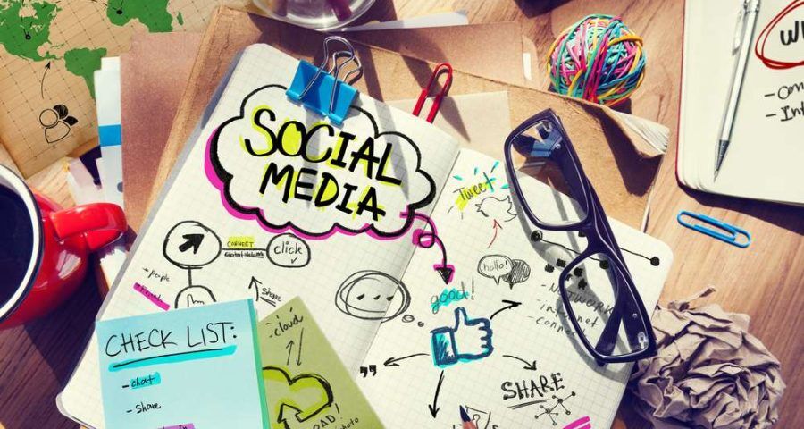 Desk,With,Social,Media,And,Connection,Concept