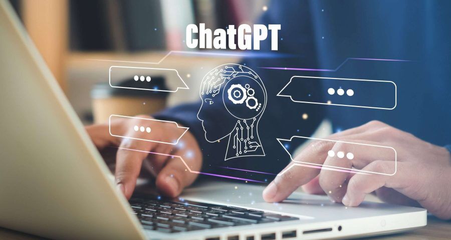 Person using ChatGPT on a laptop with AI chat interface displayed on the screen