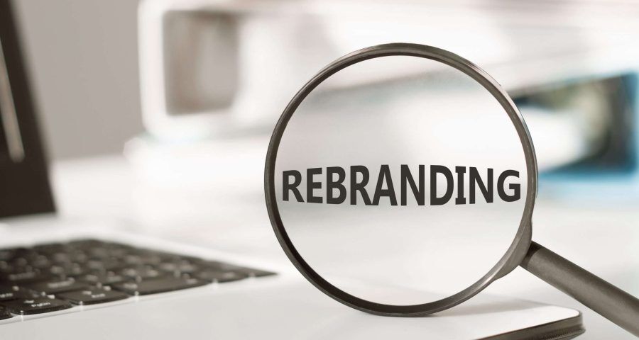 magnifying glass enhancing the word "rebranding"