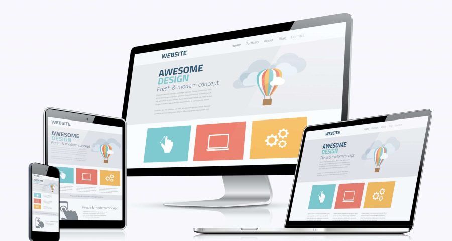 From left to right: a smartphone, an iPad, a desktop computer, and a laptop all have the same website page open. You can see three squares along the bottom to represent services.