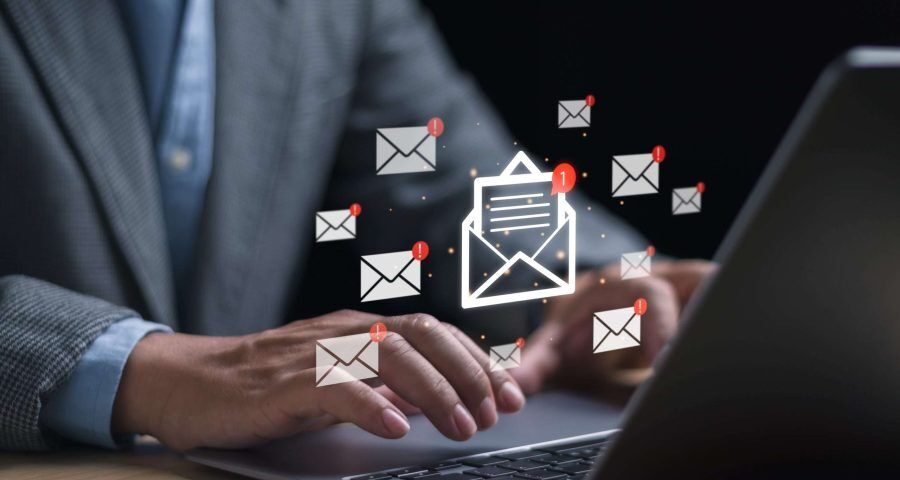 email marketing, someone using their laptop for emails
