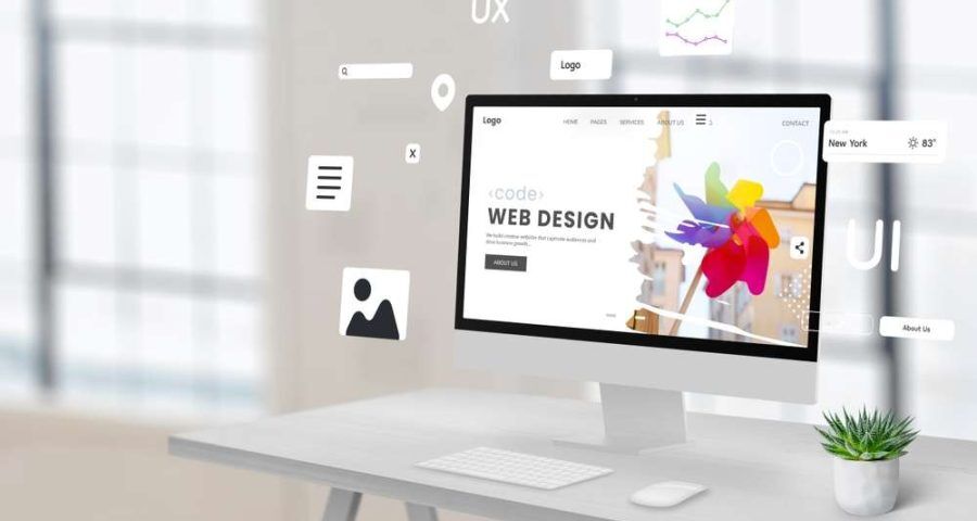 A desktop computer with the words web design written on it