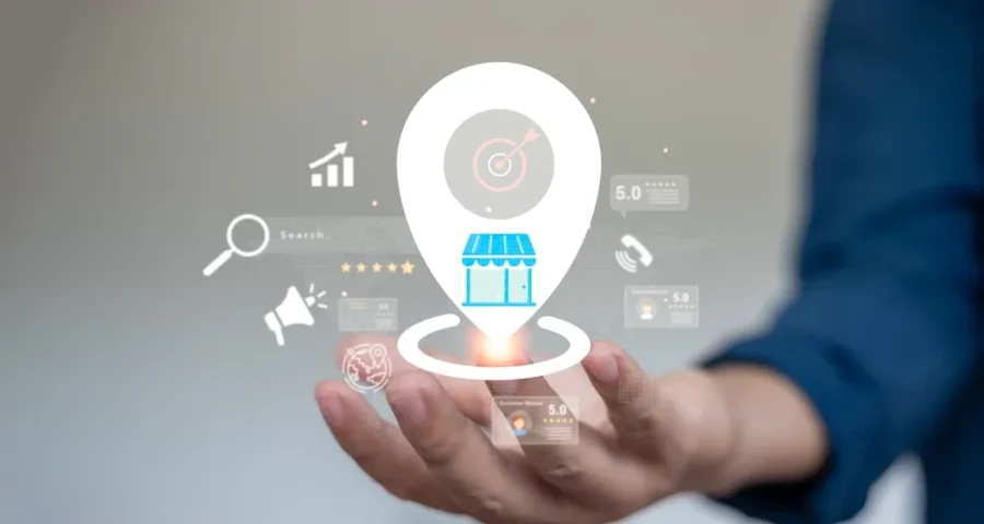 Man holding holographic image of local business SEO with other icons