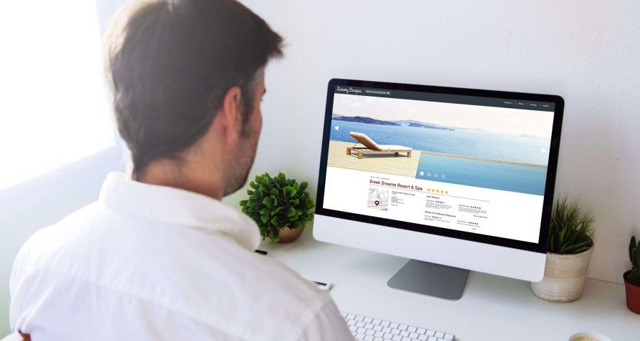 man looking at resort and spa website