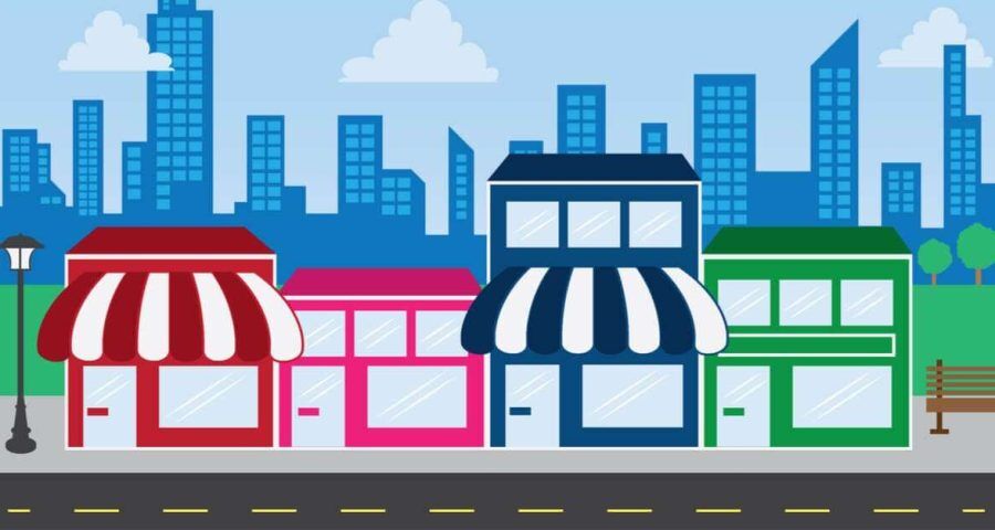 A cartoon drawing of a strip of businesses on a main street.